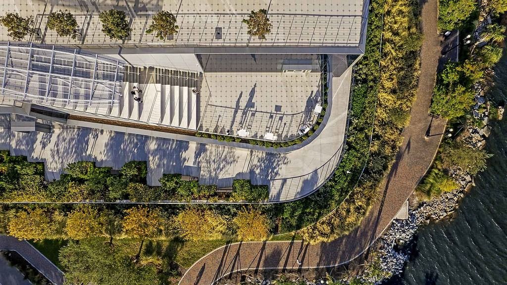 FIS: An aerial view of the tower roof, a garden and the riverwalk