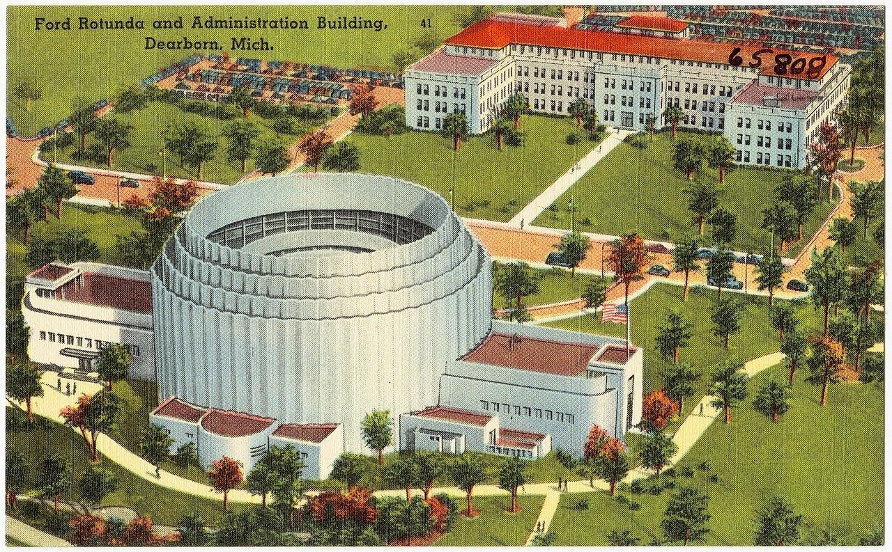 Postcard of the Ford Rotunda with the administration building behind