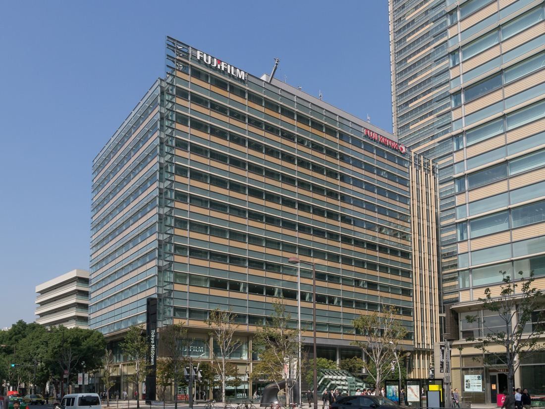 Fujifilm: Mid-rise office building with horizontal fins seen from across the street