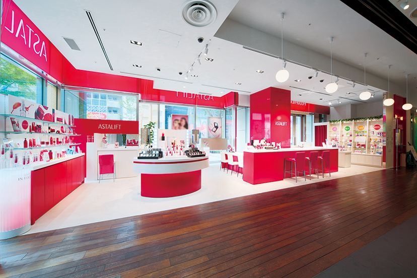 Fujifilm: Shop interior with red counters and shelves of skincare products