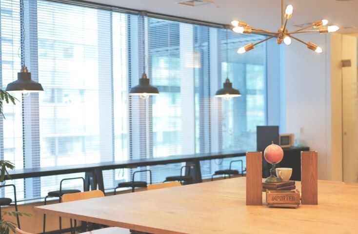 Fujifilm: Window counter and wooden table under pendant lamps