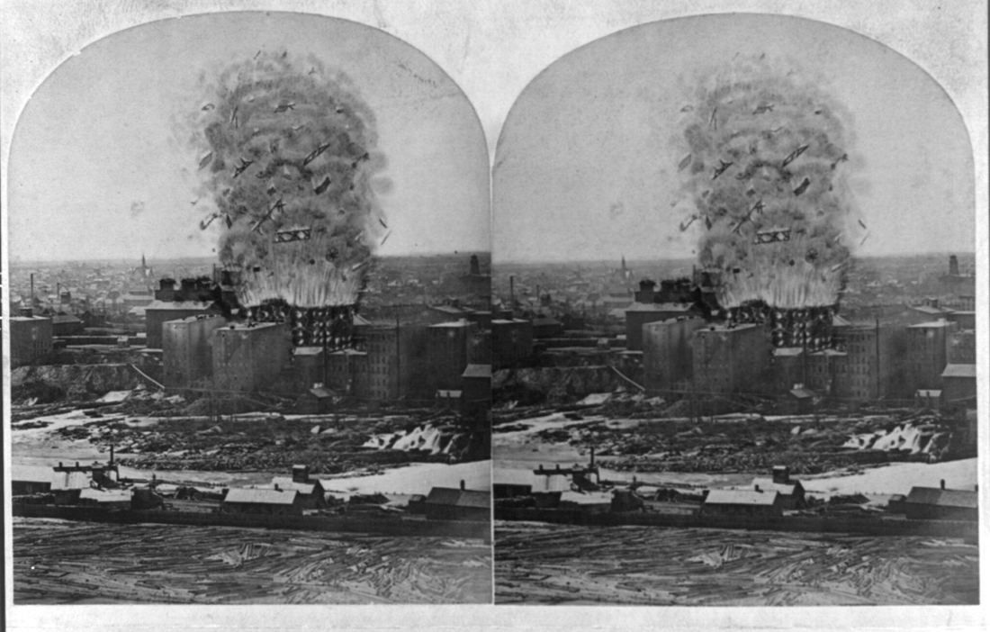 Stereograph of a mill building with a huge cloud of smoke rising above it