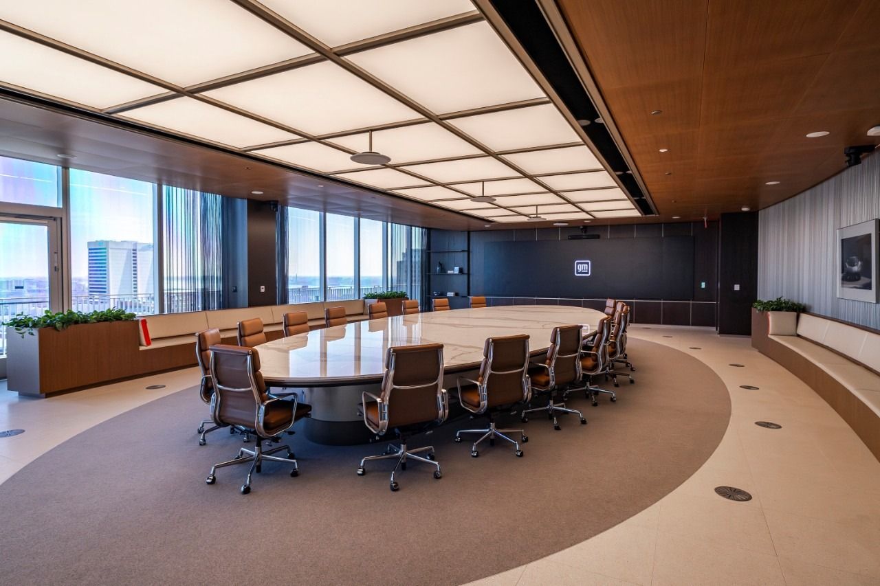 General Motors: Executive boardroom with a long table and city view