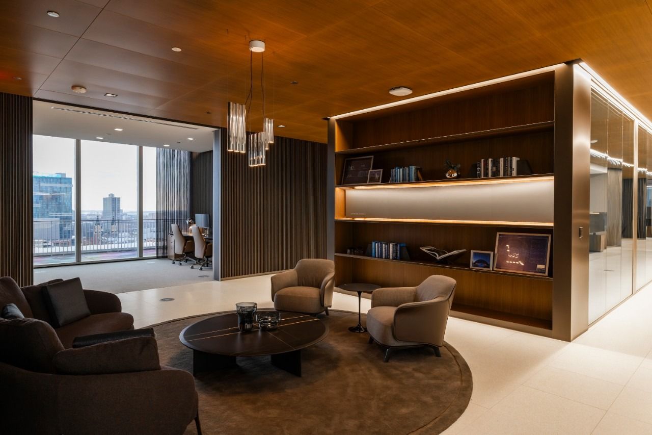General Motors: Library lounge with leather chairs and timber shelves