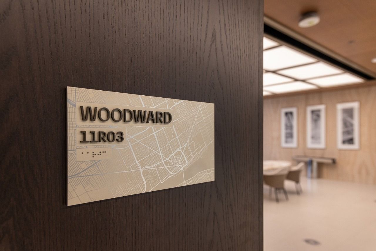 General Motors: Room sign reading Woodward beside a boardroom