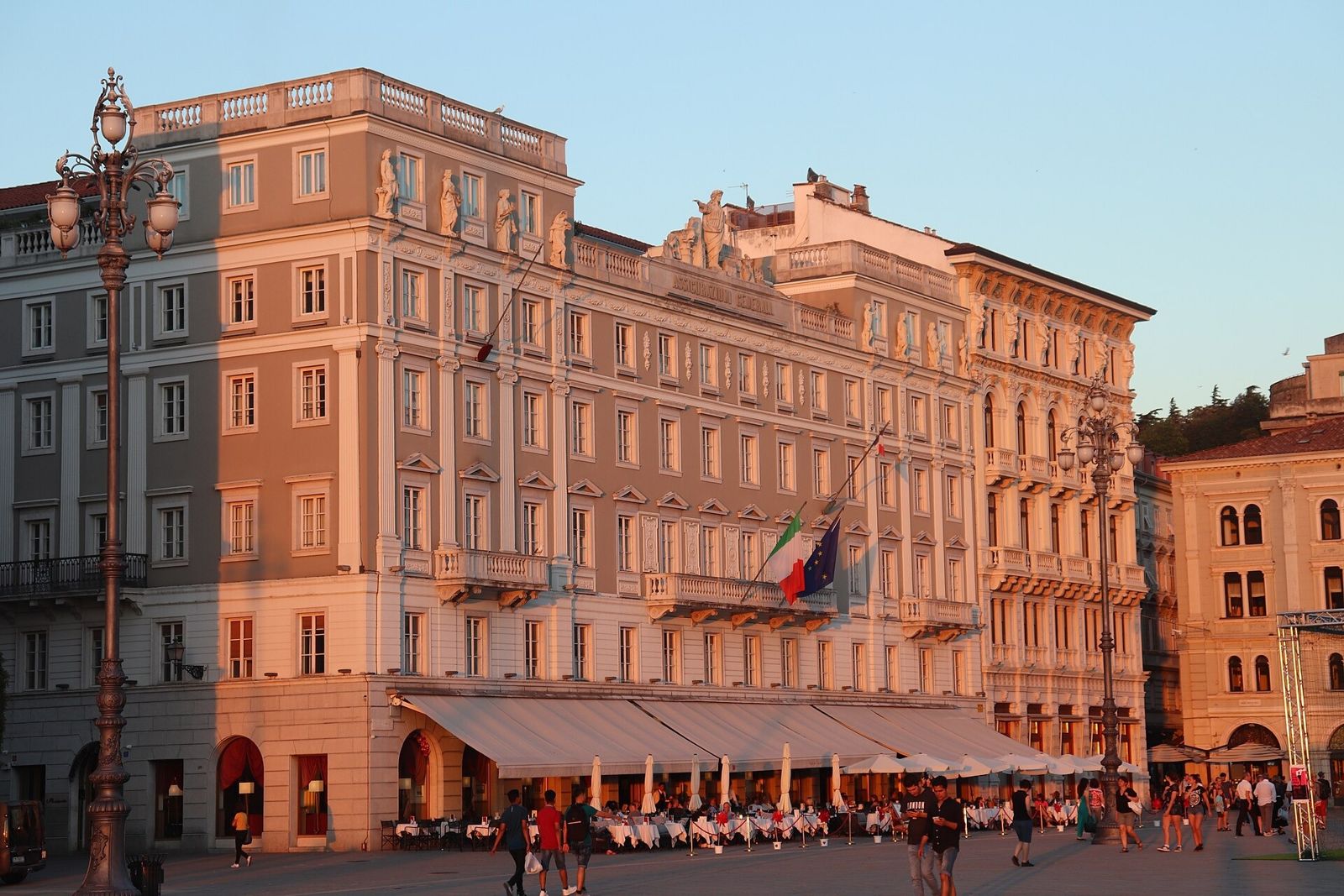 Generali: Palazzo Stratti on Piazza Unità in evening light