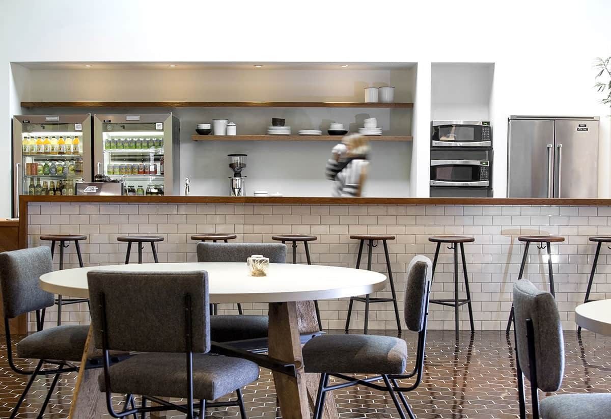 GitHub: Café with round tables and a white-tiled counter