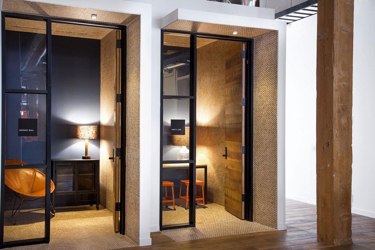 GitHub: Small rooms with black steel-framed glass doors