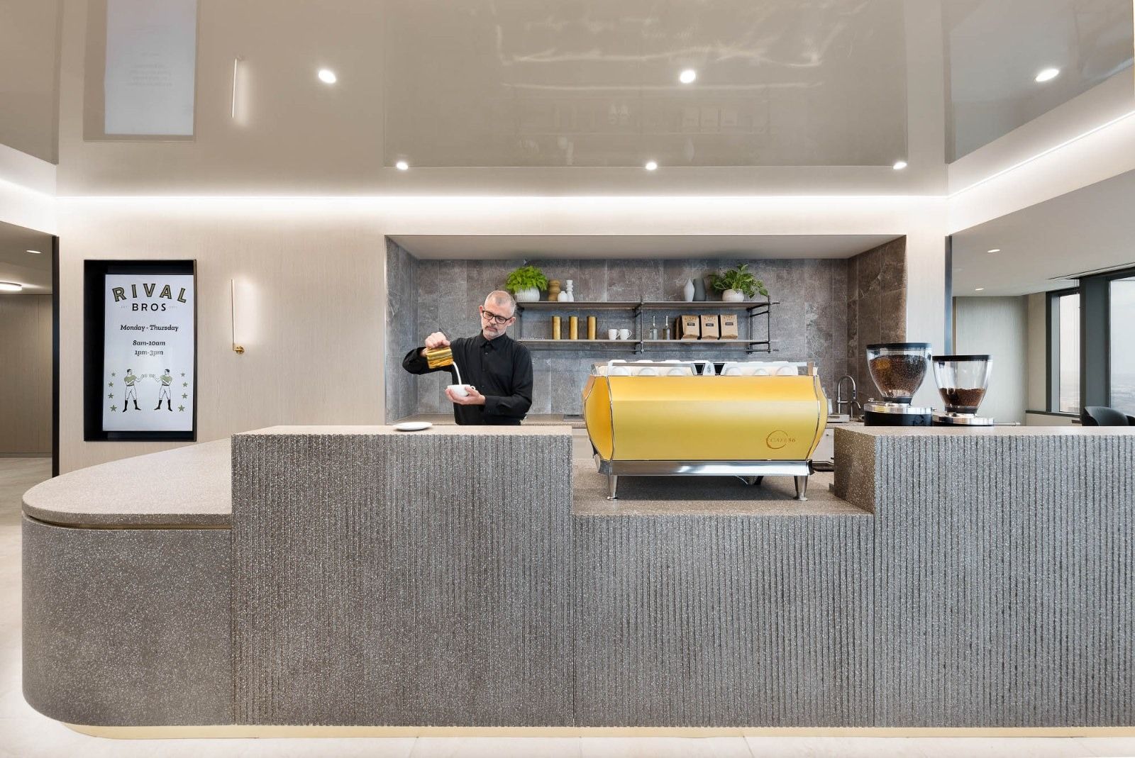 Glenmede: A barista bar with a stone counter and a yellow espresso machine