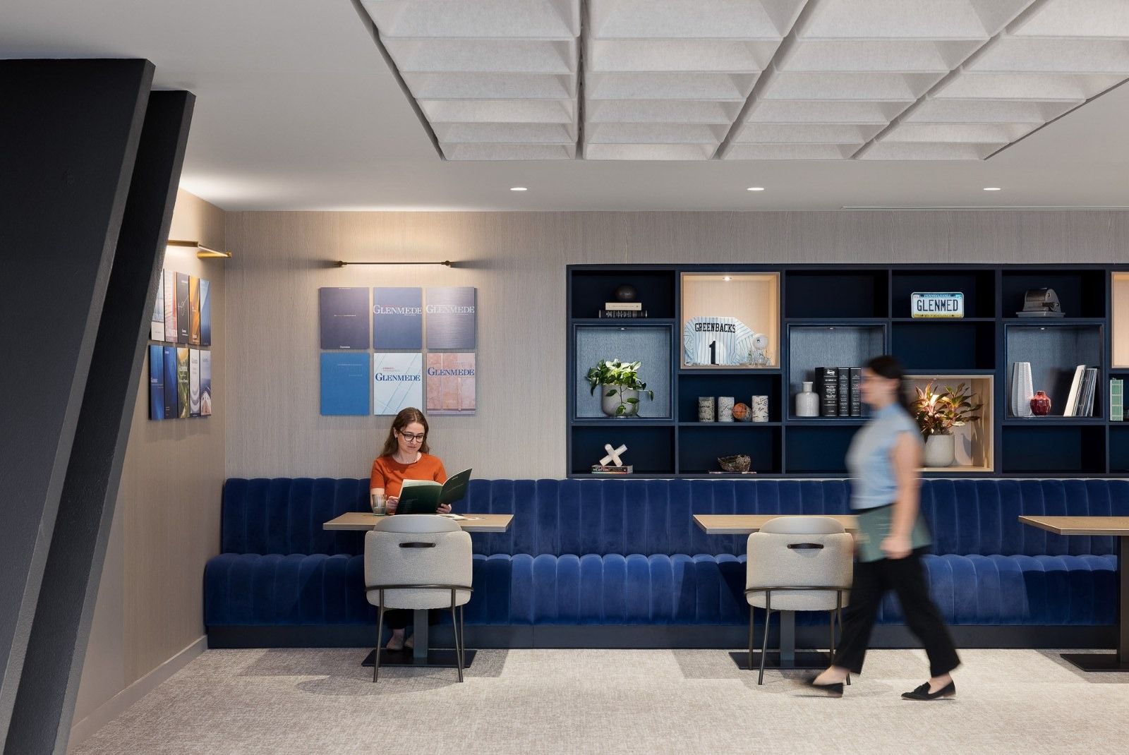 Glenmede: A blue banquette in front of bookshelves