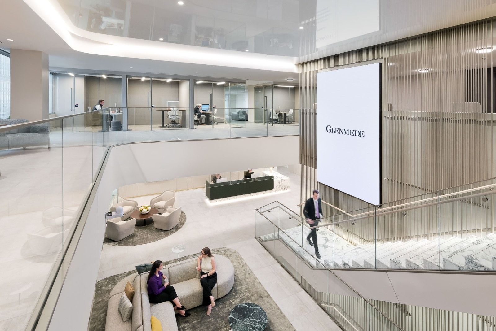 Glenmede: An atrium seen from above with lounges and a glass rail