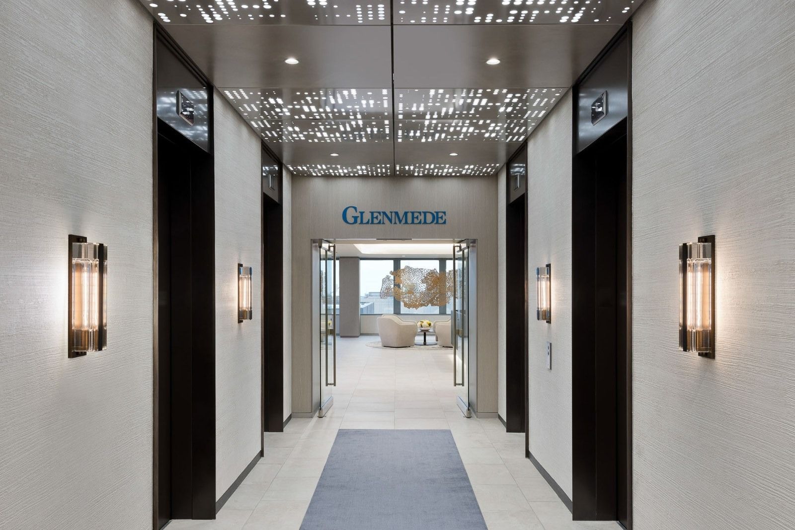 Glenmede: An elevator lobby with dark walls and the Glenmede name