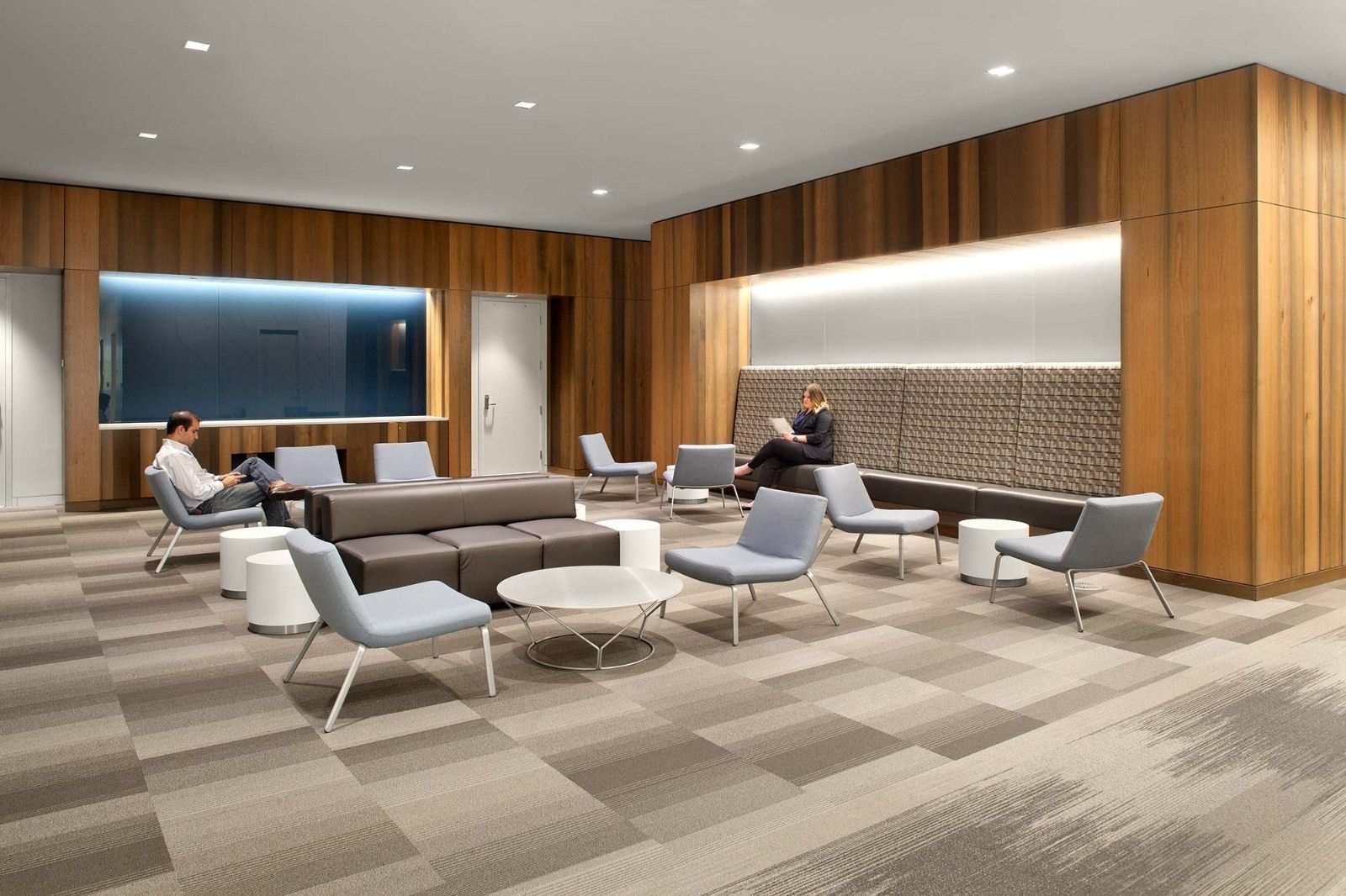 Goodyear: A lounge with wood walls, sofas and armchairs