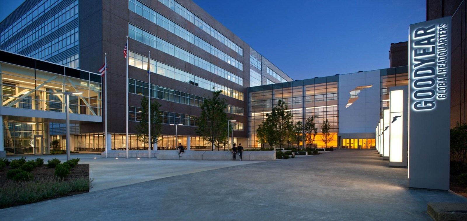 Goodyear: The entrance plaza with a Goodyear sign at dusk