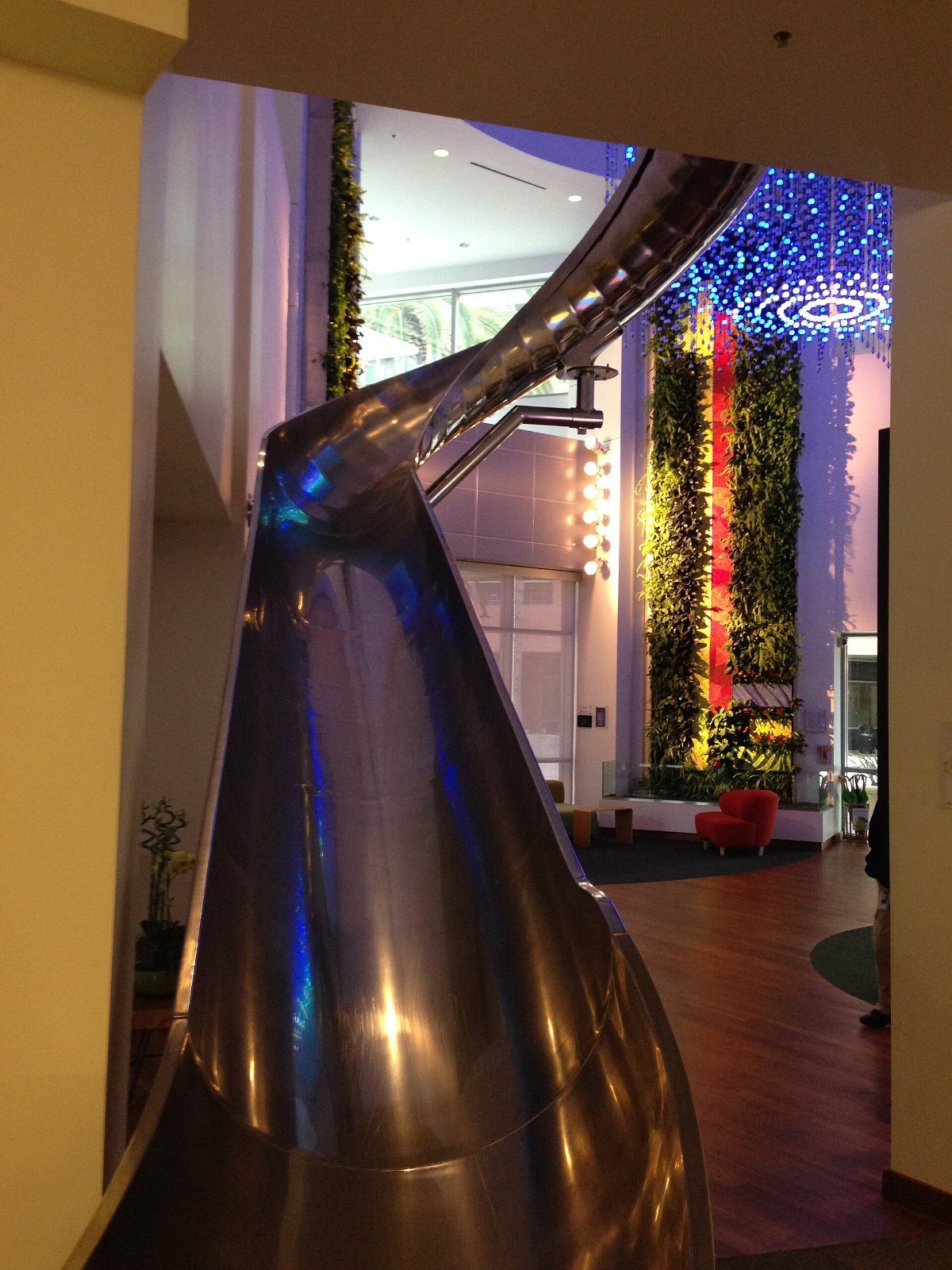 Google: A metal slide inside an office