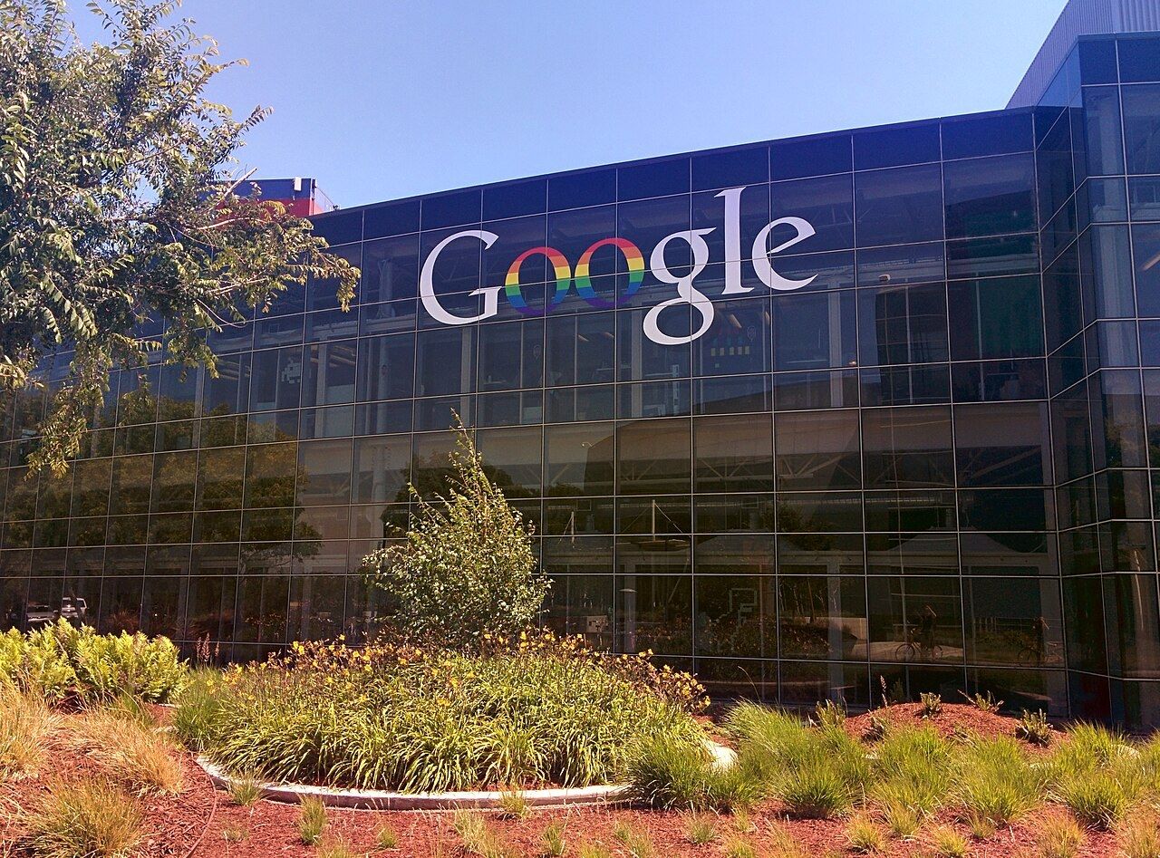 The Googleplex with a rainbow Google logo