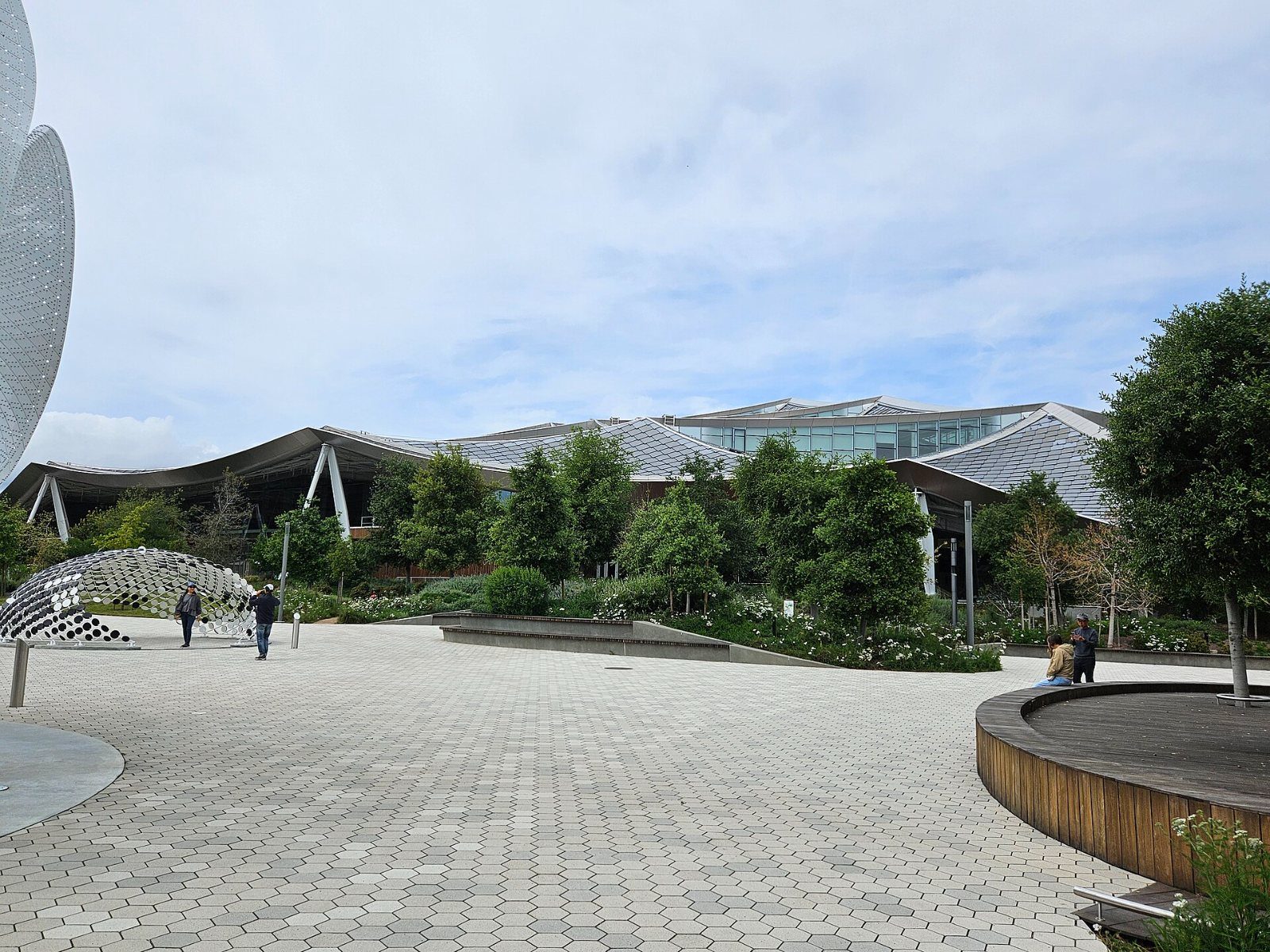 Google: Paved plaza in front of a long canopy roof