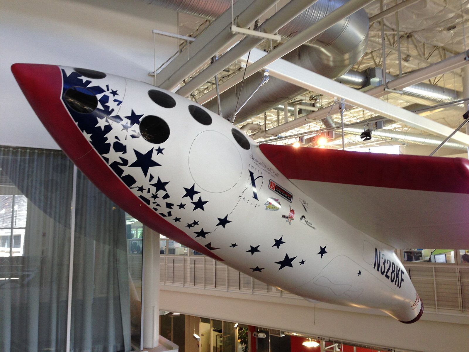 Google: White spacecraft replica hanging from a ceiling