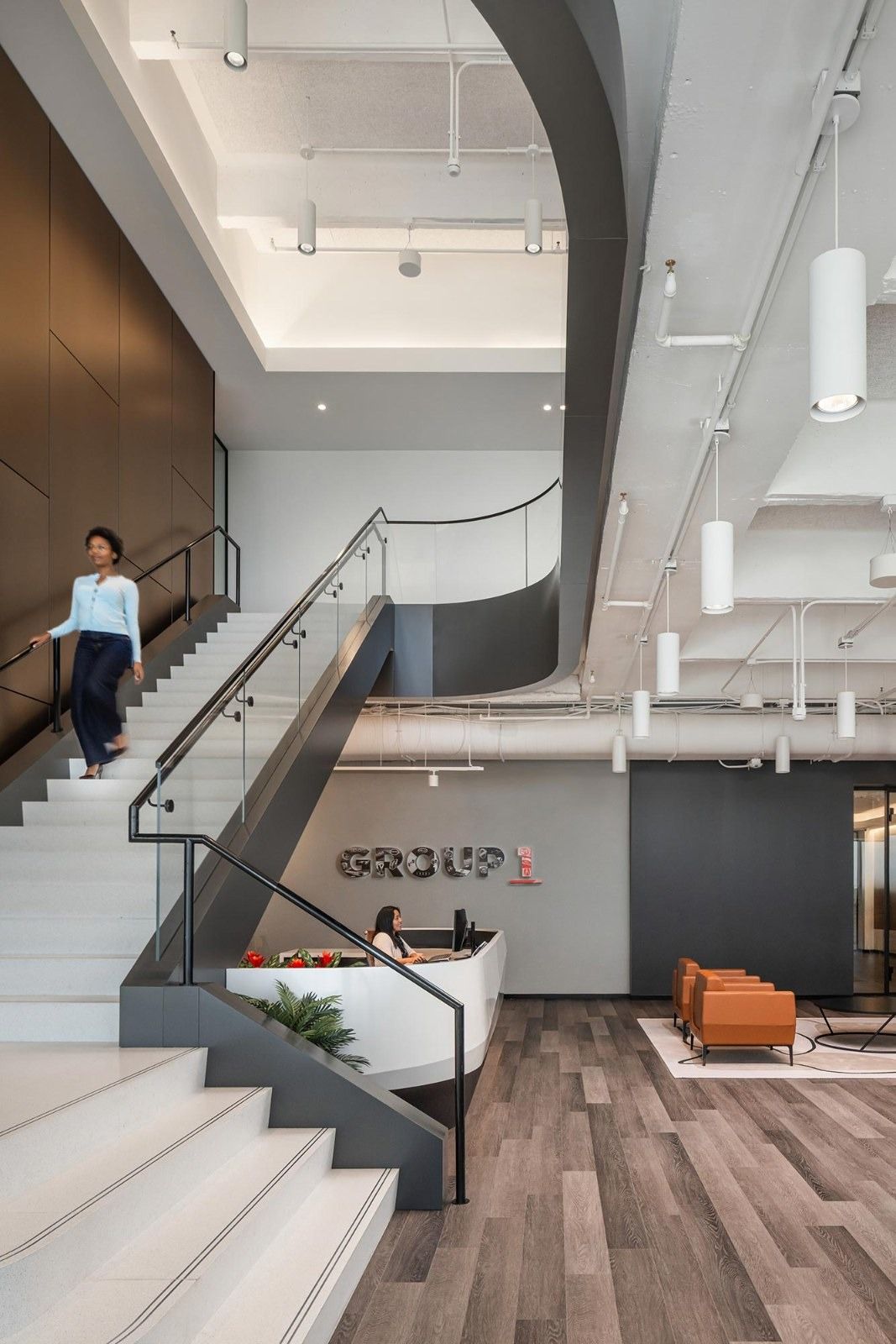 Group 1 Automotive: A curving white stair beside the reception