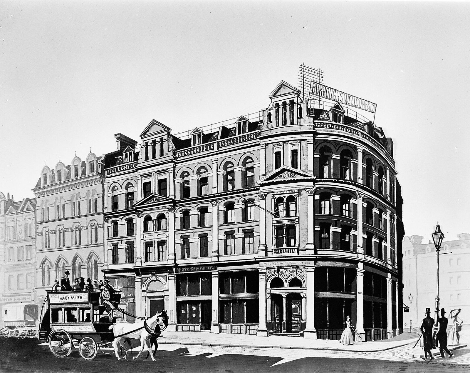 Black-and-white photo of a corner office building with a horse-drawn carriage