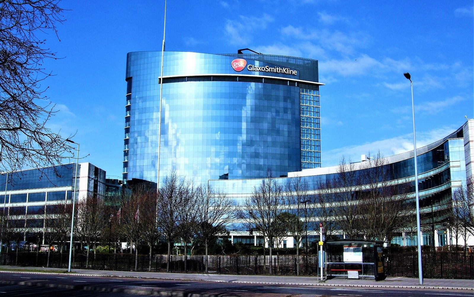 GSK: Curved blue glass office tower