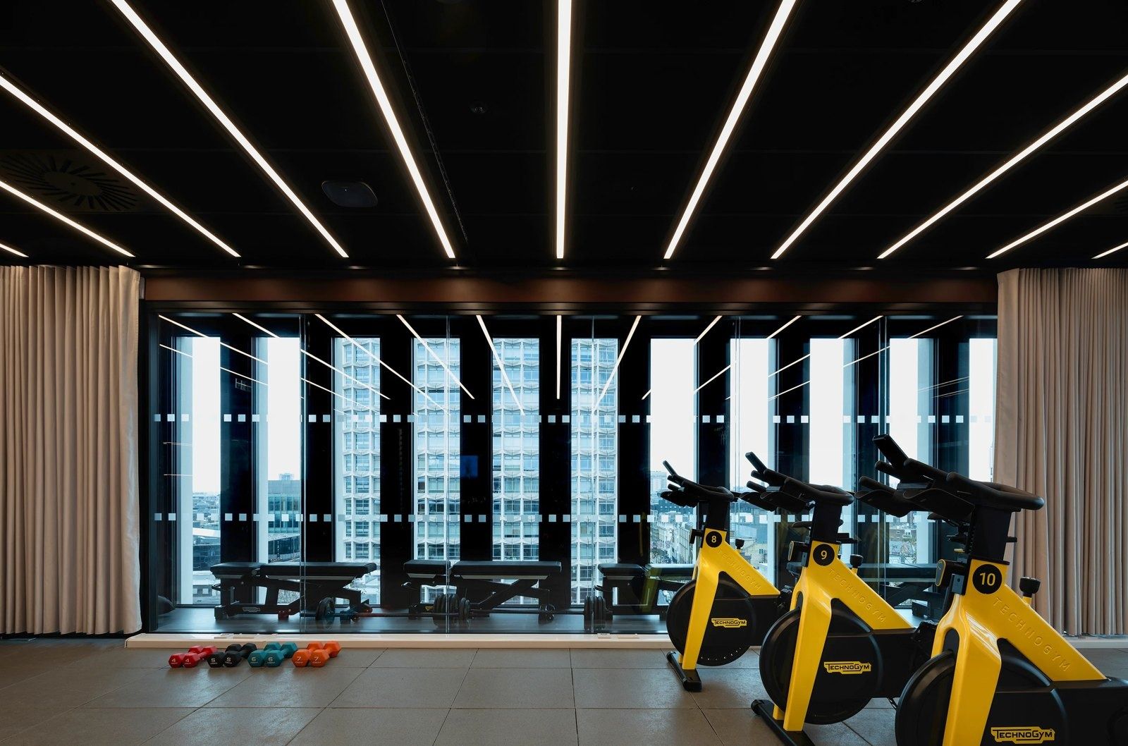GSK: Exercise bikes in front of tall windows