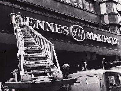 A new Hennes & Mauritz sign going up on a building