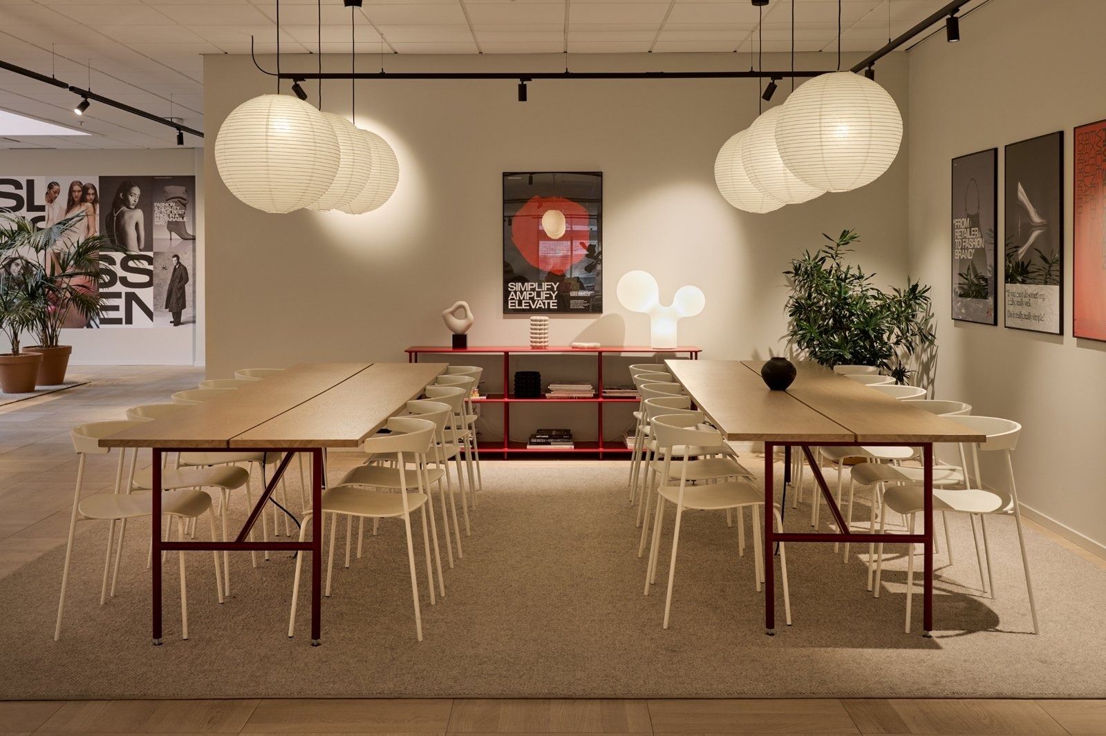 H&M Group: Long meeting tables under paper globe lamps