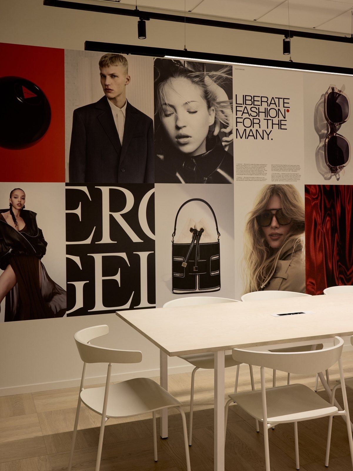 H&M Group: Meeting area in front of a wall of fashion images