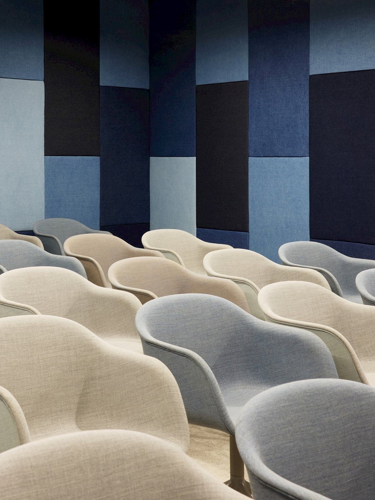 H&M Group: Rows of upholstered chairs in an event space