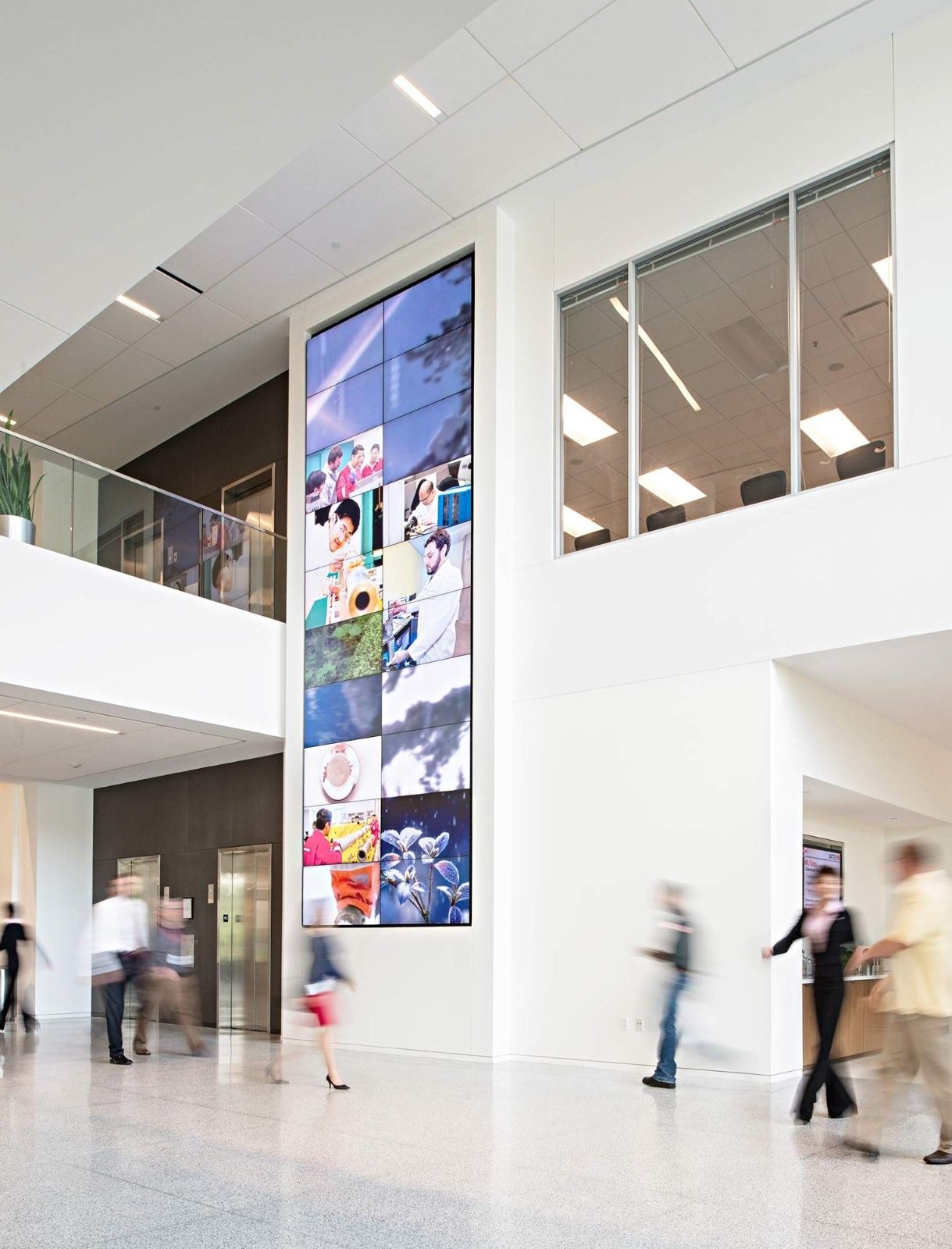 Halliburton: A tall entrance hall with a video screen