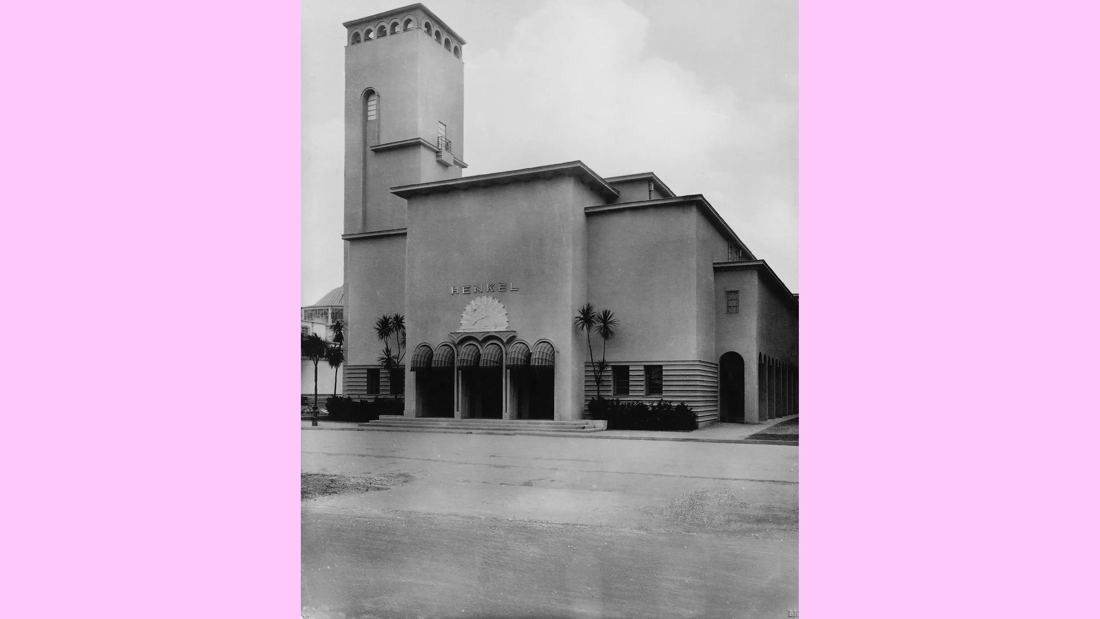 Black-and-white photo of a pavilion with a tower and arched entrance
