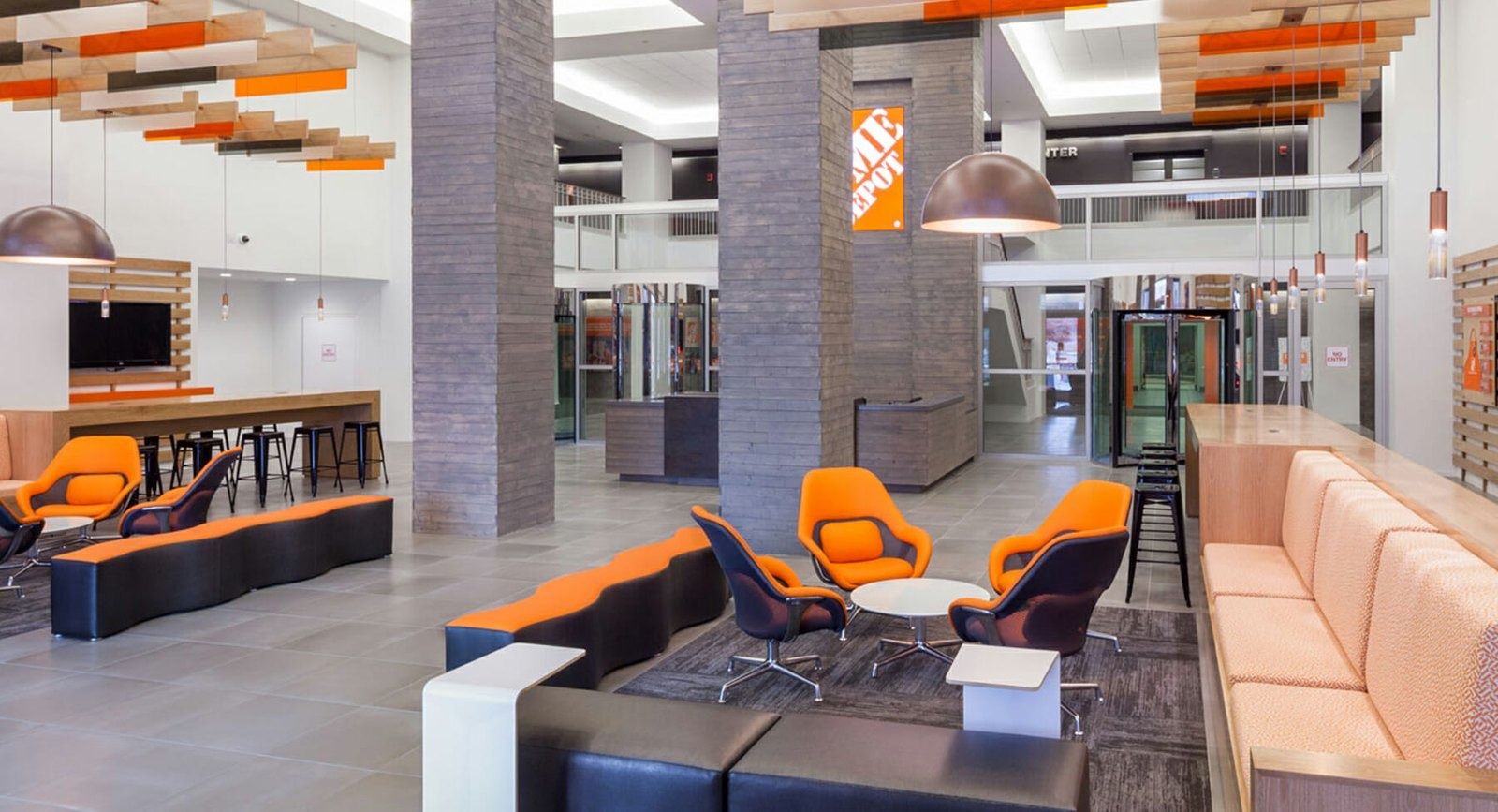 The Home Depot: Lobby seating with orange chairs
