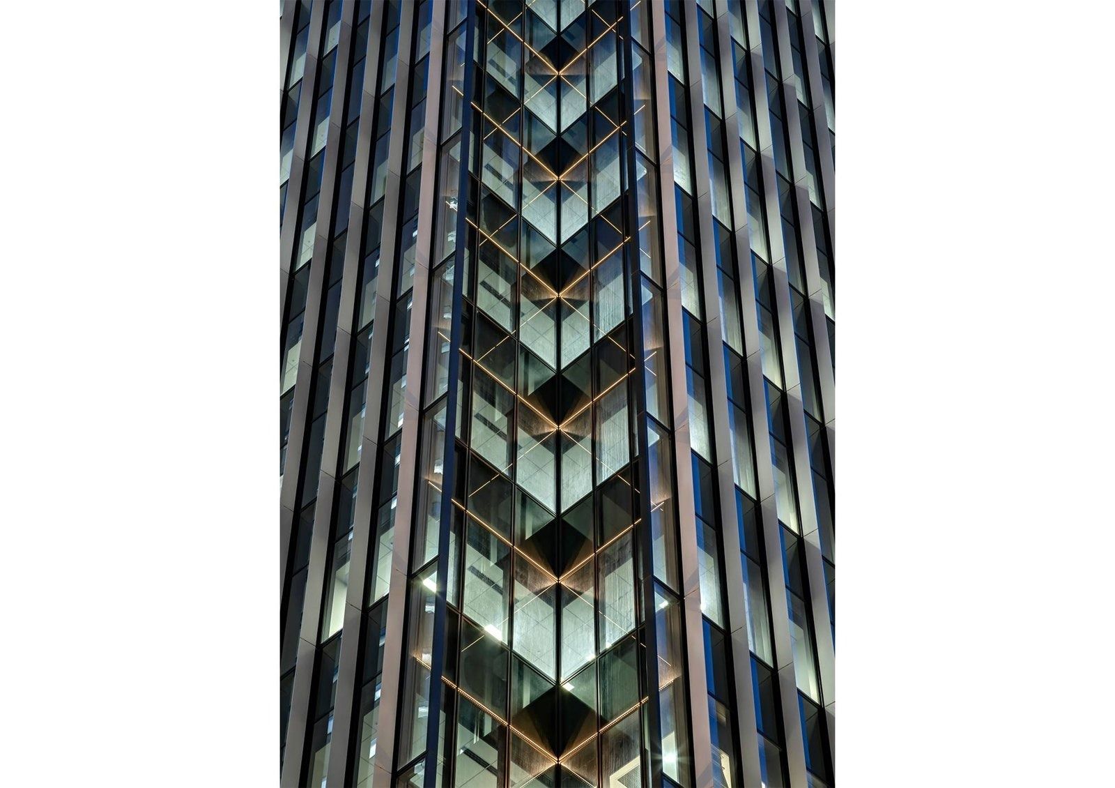 Honda: Close view of the tower's glass façade at dusk