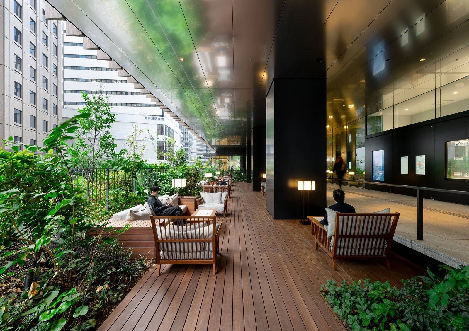 Honda: Covered timber terrace with chairs among plants