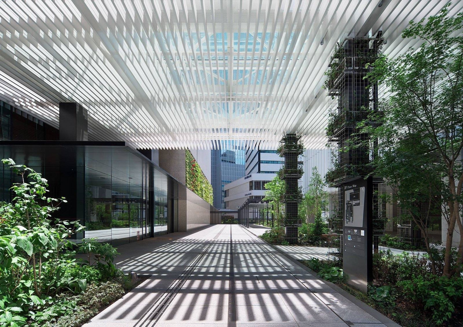 Honda: Open-air walkway under a white louvered canopy