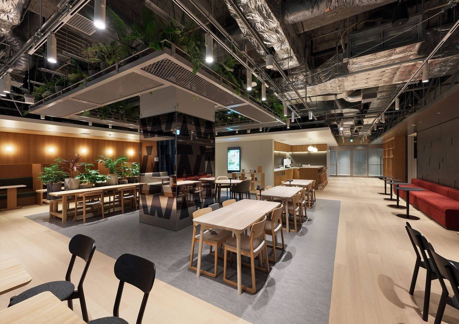 Honda: Timber-framed workspace with long tables and plants