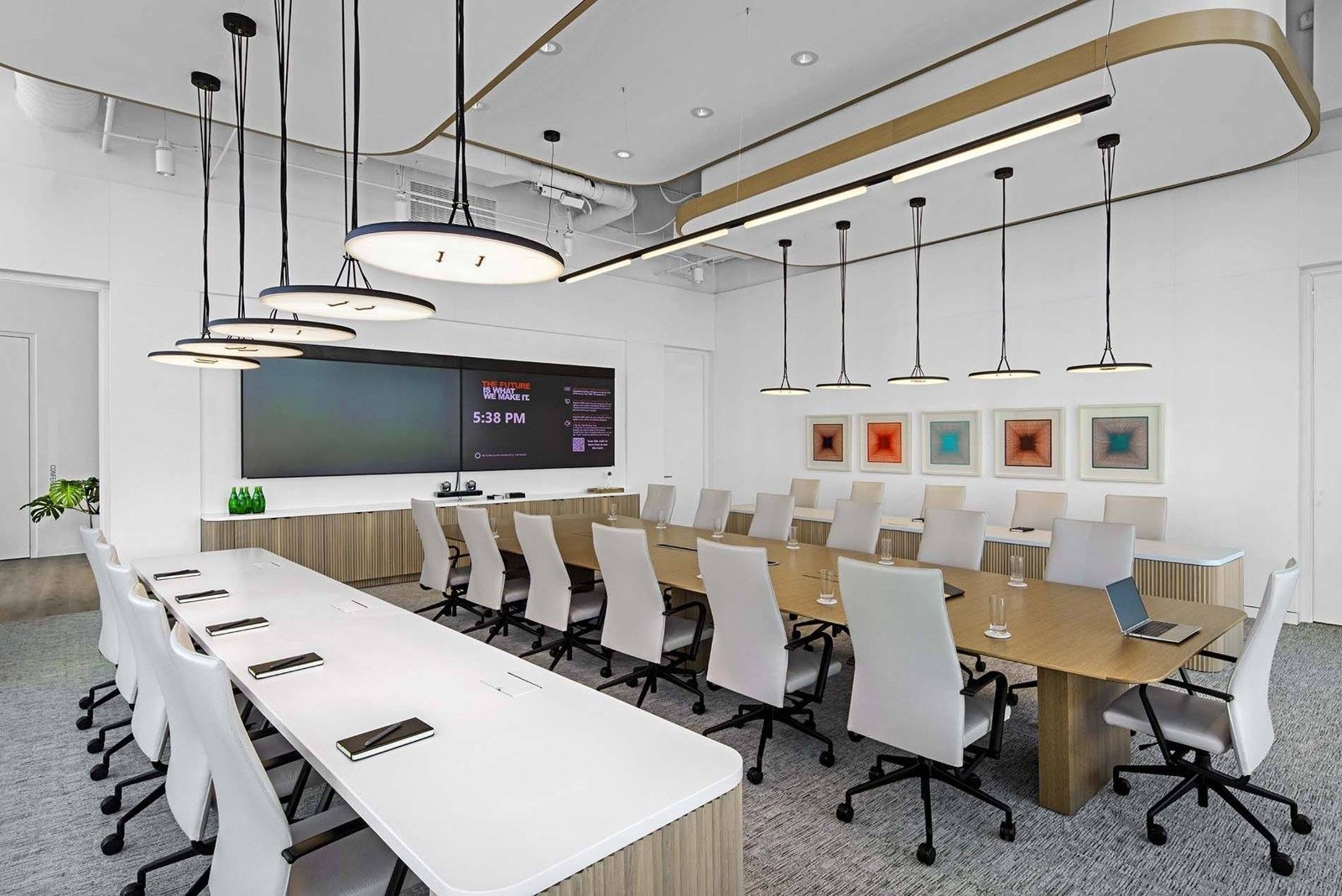 Honeywell: Boardroom with white chairs and pendant lights