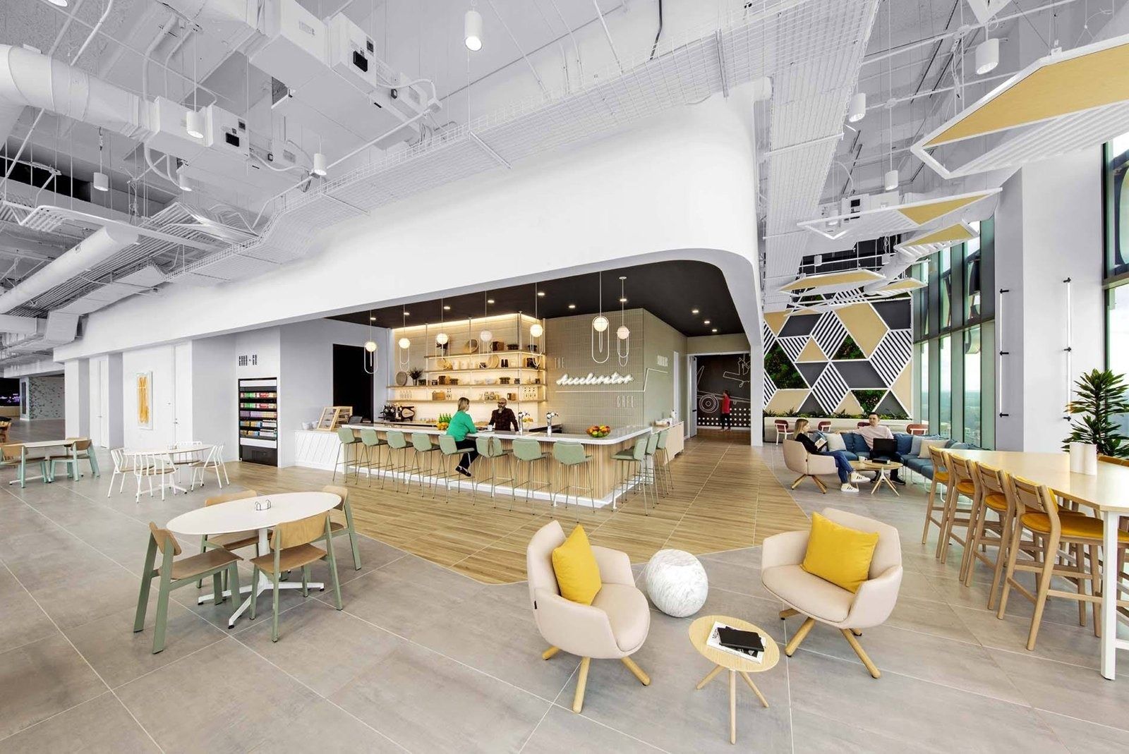 Bright café with a counter, armchairs and patterned wall