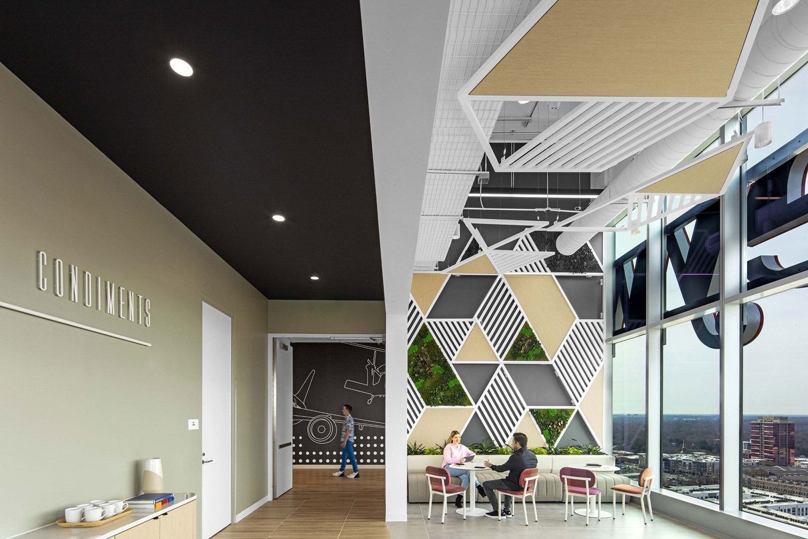 Honeywell: Lounge with triangle-patterned wall
