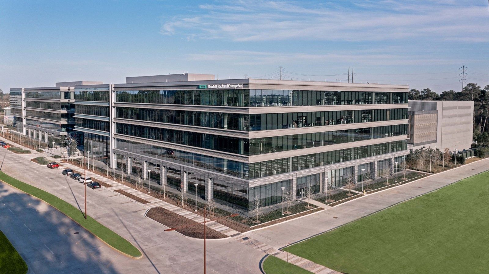 Hewlett Packard Enterprise: Elevated view of office buildings along a curving road and lawn