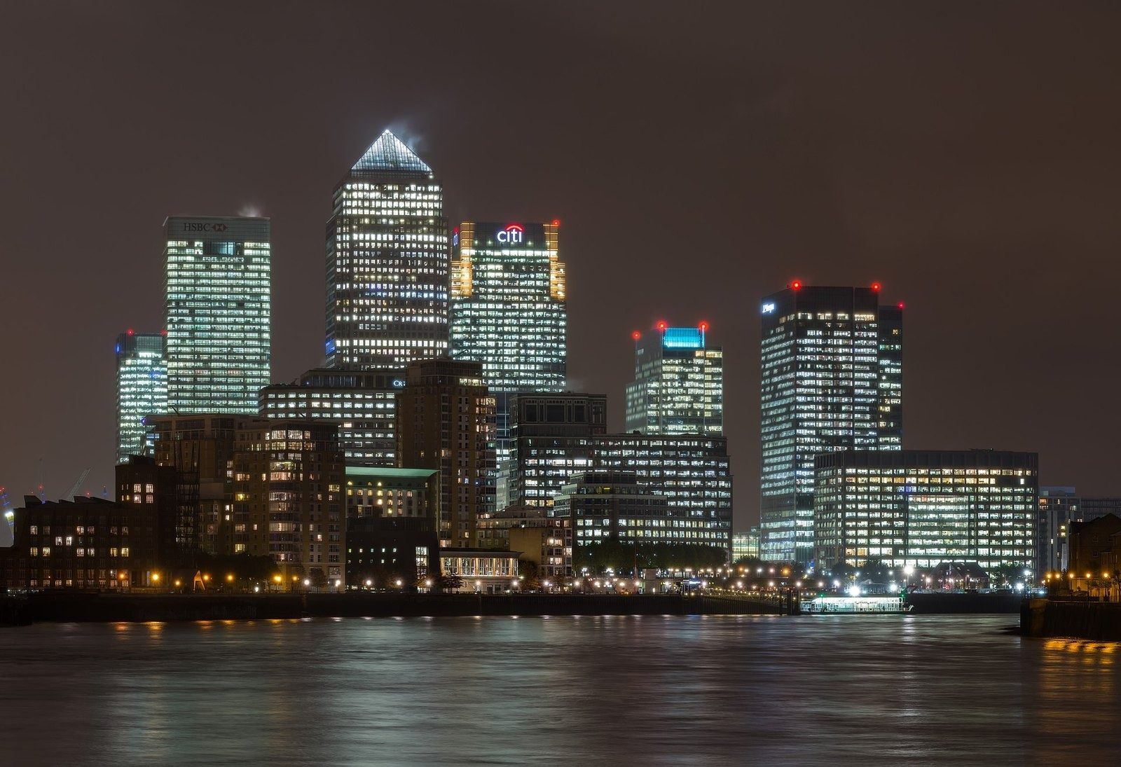 HSBC: Canary Wharf towers lit up at night above the Thames