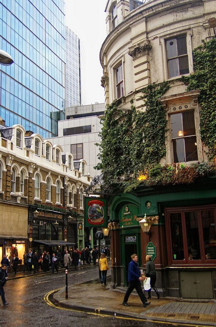 Old Broad Street with a corner pub and office buildings