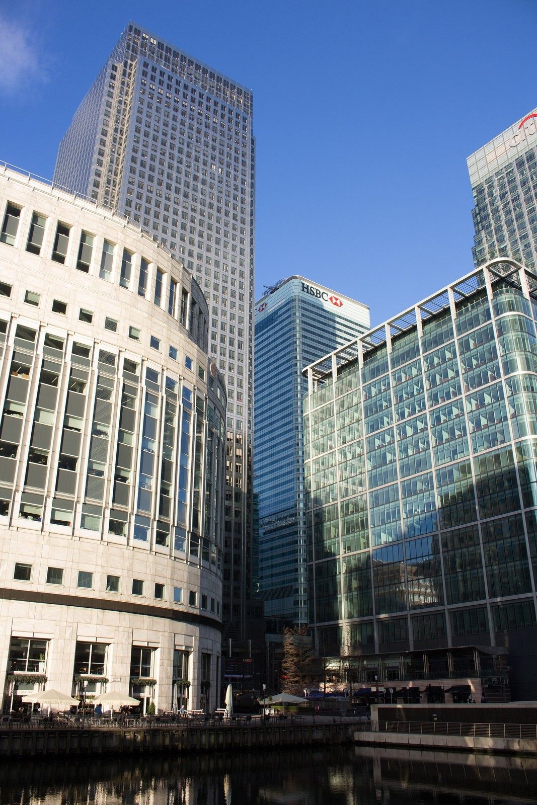 HSBC: Looking up at a group of towers including a curved stone building