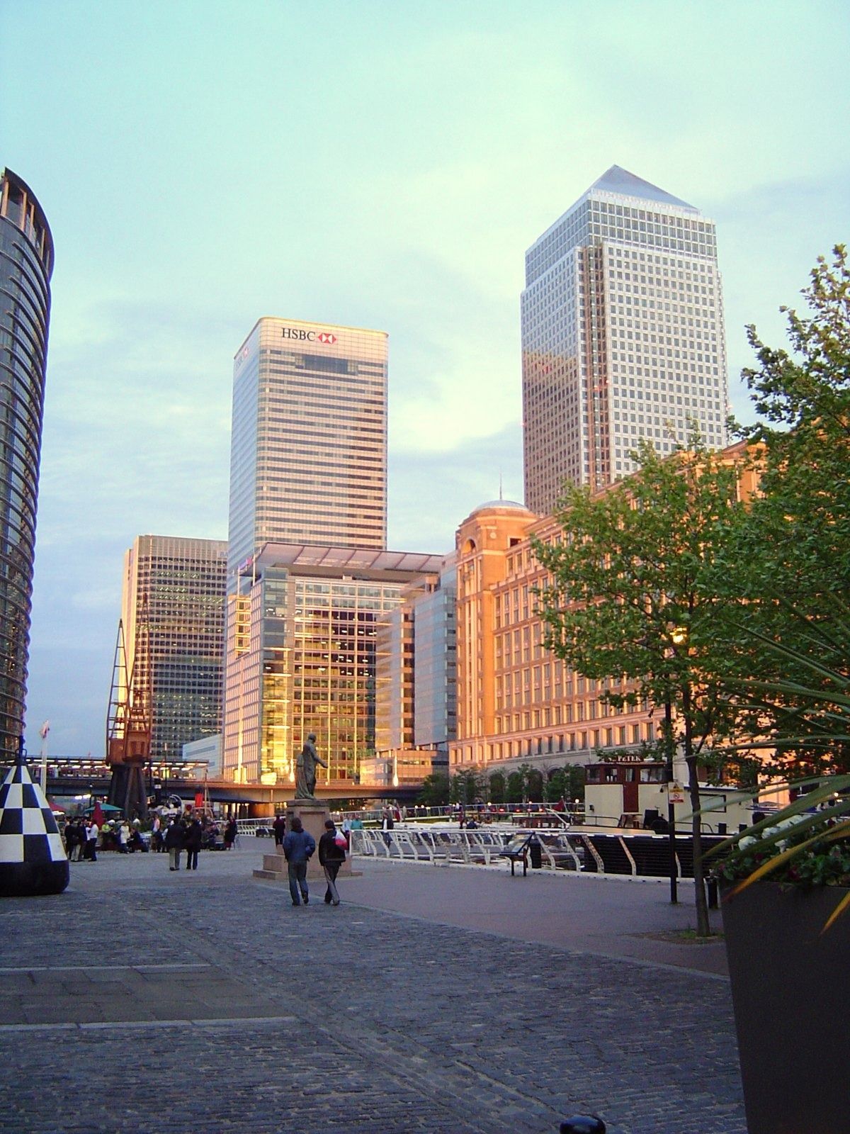 HSBC: Two towers in soft evening light seen across a paved square