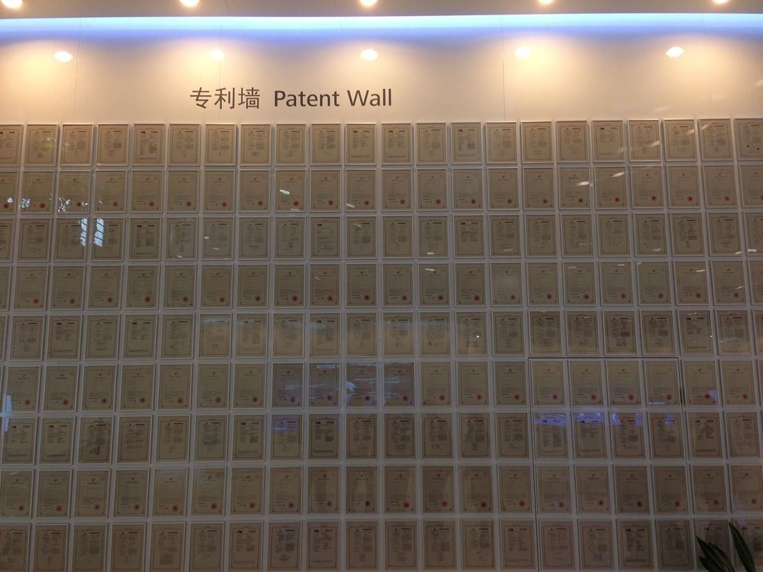 Huawei: Backlit wall covered with framed patent certificates