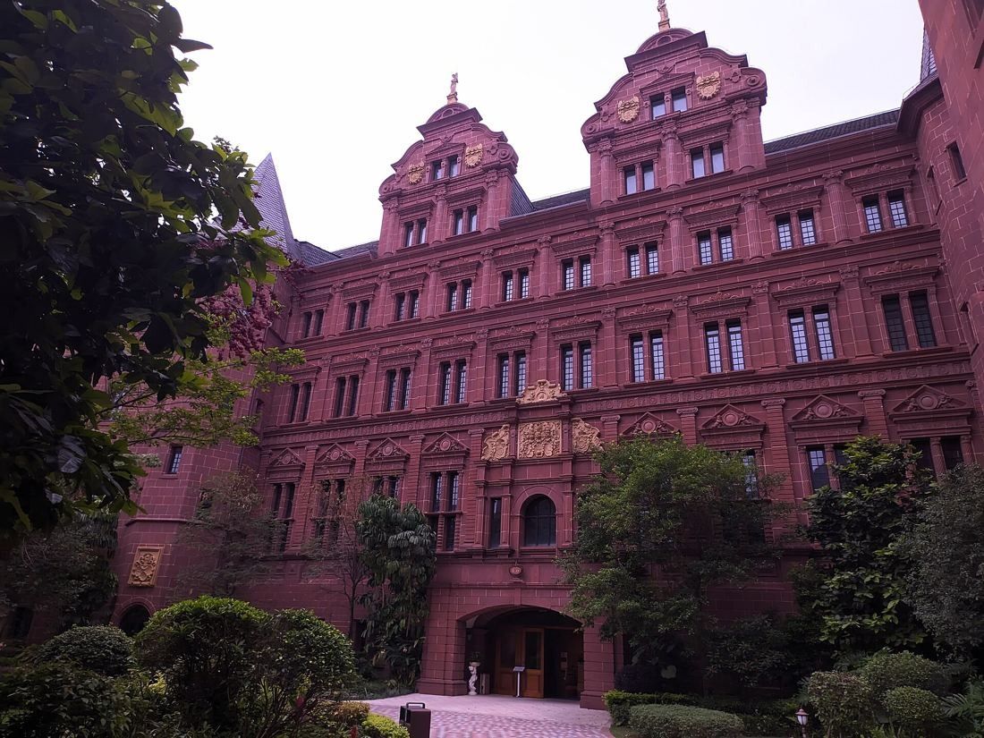 Huawei: Ornate red Renaissance-style facade with stepped gables