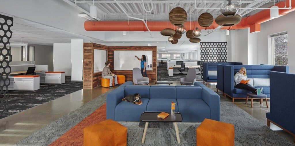 HubSpot: Blue sofas and booths under orange ducts