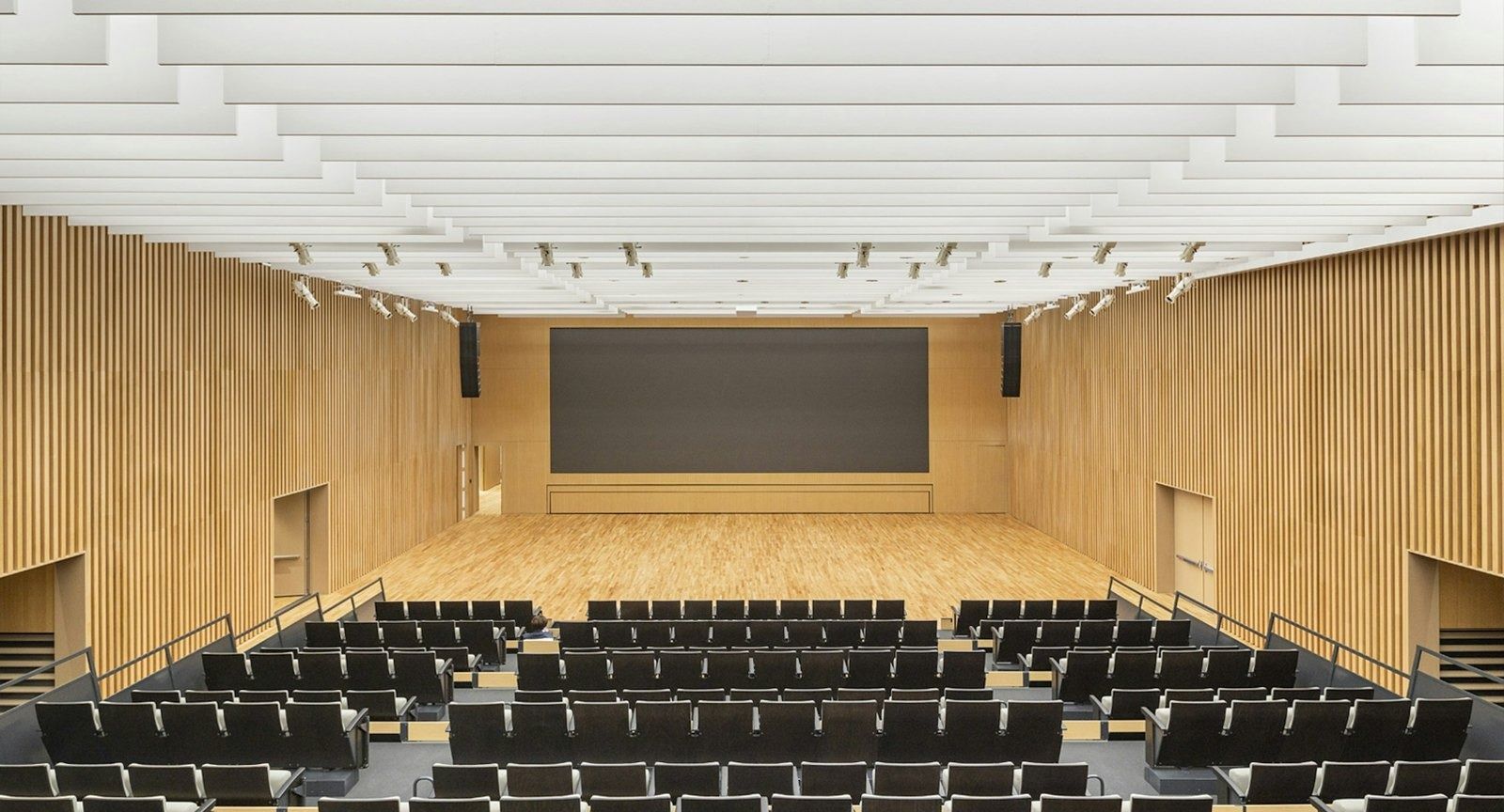 Hyundai Motor Company: Auditorium with rows of chairs and timber walls