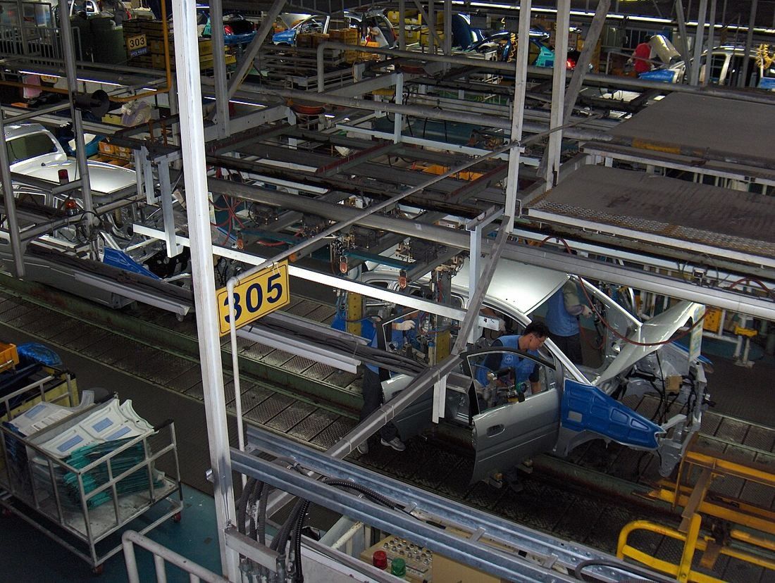 Car assembly line inside a factory